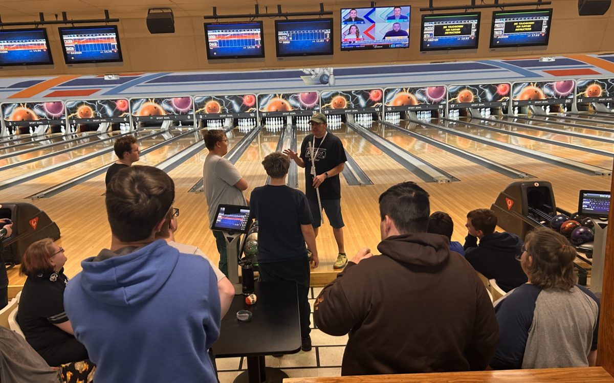 Coach Beltran talks to the bowling team