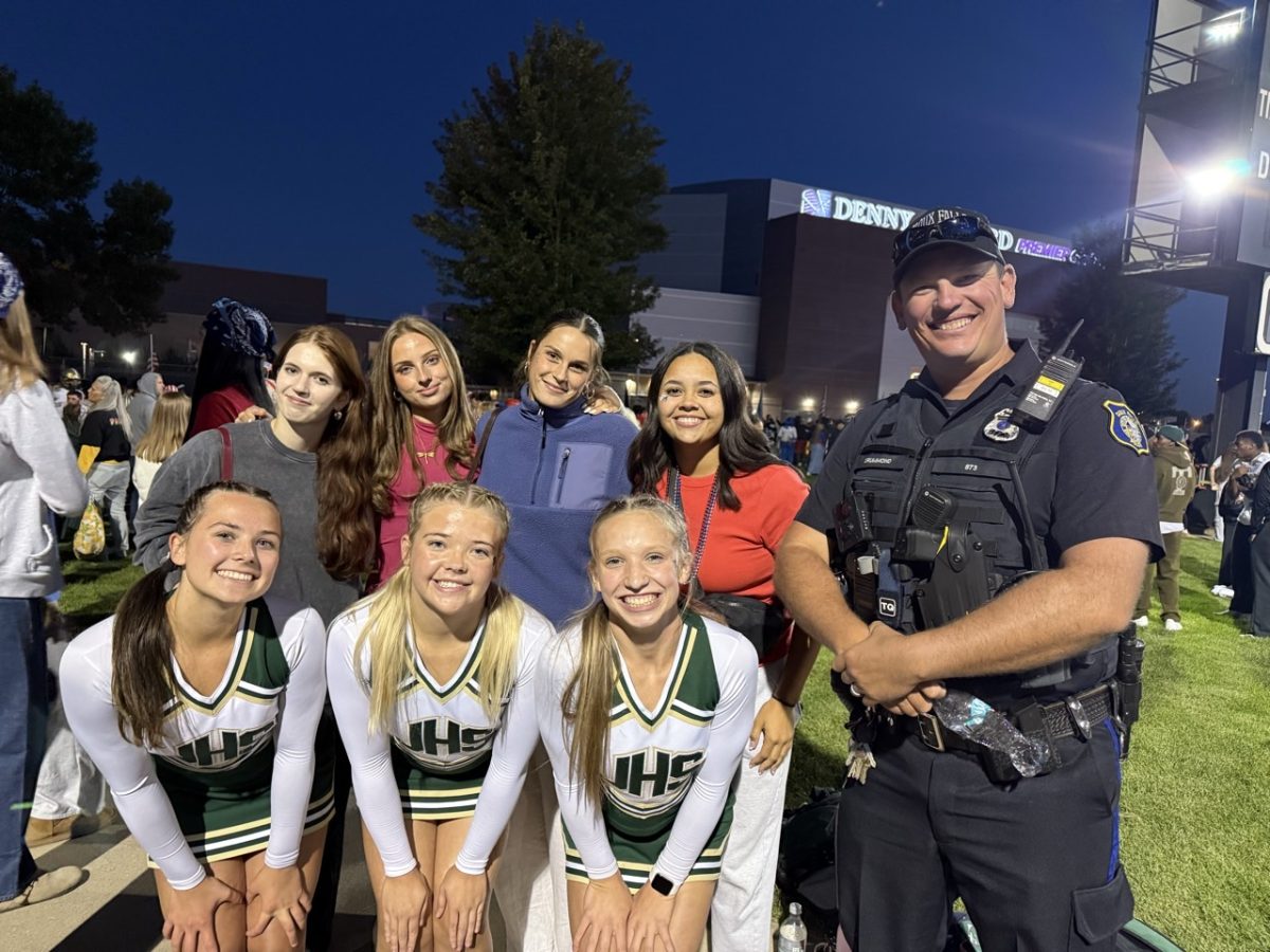 German exchange students join JHS cheerleaders at Howard Wood Field, experiencing the excitement of a football game. (Photo Submitted)
